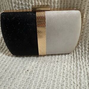Elegant Black and White Clutch with Gold Accent